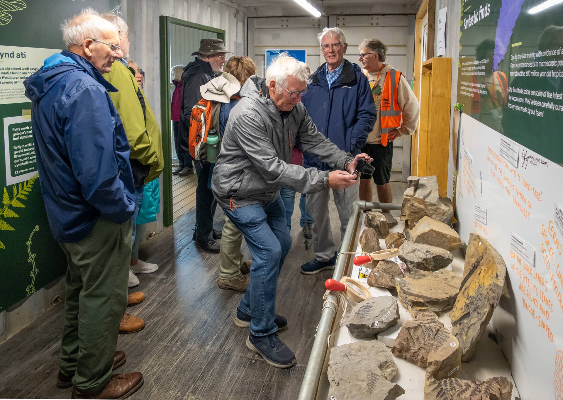 Earth & Beyond group members viewing fossil exhibits at Stori Brymbo